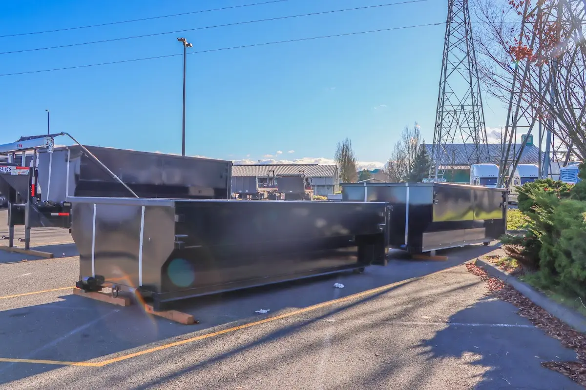Roll-off dumpster ready for waste disposal at job site for 3 Yard Dumpster Rental in Rochester